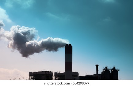 Smoke Comes Out Of Factory Chimneys / Environment And Industry And Air Pollution, Dust, Smog, Fine Dust