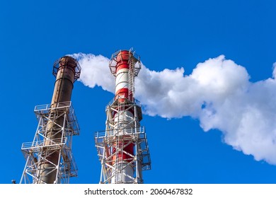 Smoke Coming From The Pipe Of A Thermal Power Plant. Natural Gas Used For Heating And Electricity Generation.