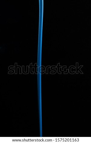Smoke in the darkness with a blue lighteffect