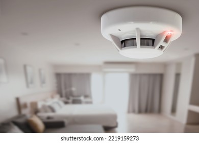 smoke detector fire alarm detector home safety device setup at home hotel room ceiling - Shutterstock ID 2219159273
