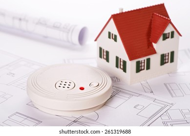 Smoke Detector With House And Blueprints