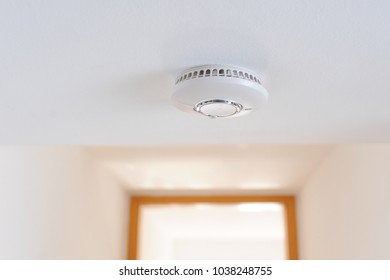 Smoke Detector Unit Sitting On Ceiling In Private Home