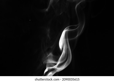 Smoke effect on black background. Fog or mist texture, abstract and flowing 