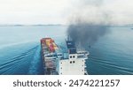 Smoke exhaust gas emissions carbon dioxide from cargo lagre ship container ship,Marine diesel engine exhaust gas from combustion, Gas Emission Air Pollution from transportation. green house effect 
