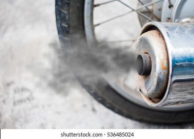 Smoke From Exhaust Tube Of A Motorcycle