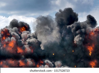 Smoke And Fire Fill A Blue Sky As A Terrible Explosion Happens At An Event