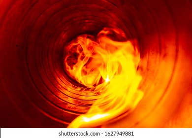 Smoke And Fire Inside The Air Duct In The Ventilation System, The Front And Back Background Is Blurred With A Bokeh Effect