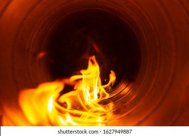 Smoke And Fire Inside The Air Duct In The Ventilation System, The Front And Back Background Is Blurred With A Bokeh Effect