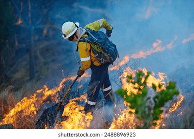 Smoke, flame and firefighter in forest for emergency, disaster management and damage control in bush. Mountain, help and man with fire rescue, volunteer service and courage for nature conservation