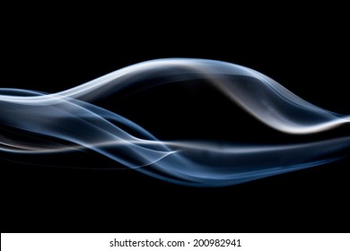 smoke floating on a black background.