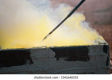 Smoke Molten Gold Being Poured Into Buddha Statue In Thailand.