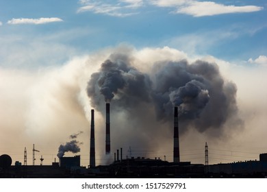 The smoke of the Norilsk combine. The sky in the smoke from the chimneys of Norilsk Nickel plant. - Shutterstock ID 1517529791