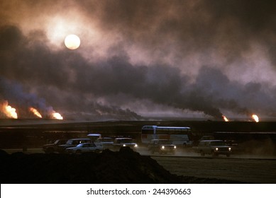 The Smoke From Oil Well Fires Forces Kuwait Drivers To Use Their Headlights During Daylight. Retreating Iraqi Troops Set Fire To Kuwait's Oil Fields. April 22 1991.