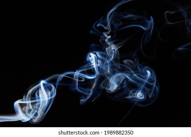 smoke on black background with abstract blur motion wave swirl . Wisp of Smoke. Cigarette smoke waves and clouds  texture