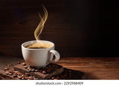 smoke on coffe cup ,old wooden plate and coffee bean