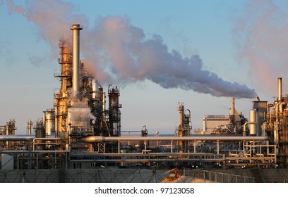 Smoke from the pipes of oil refinery