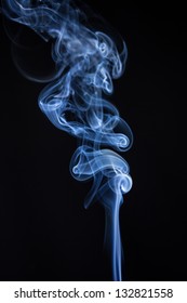 Smoke Rising On Black Background