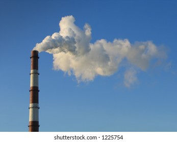 Smoke Stack On A Blue Sky Background