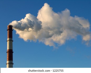 Smoke Stack On A Blue Sky Background