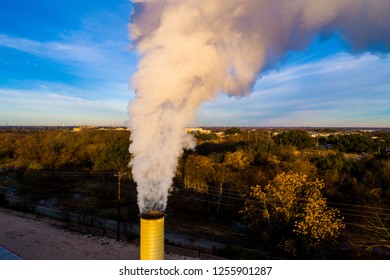 Smoke Stack Pollution And Climate Change. Thick Smog Rises From Pipe In A Aerial Drone View Above Smoke Stack