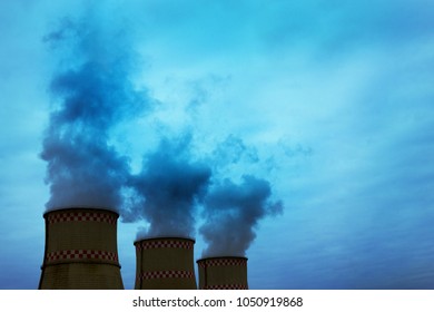 Smoke from two industrial chimneys. Global warming. Air polution.
