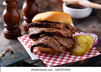 Smoked barbeque beef brisket sandwich with pickles