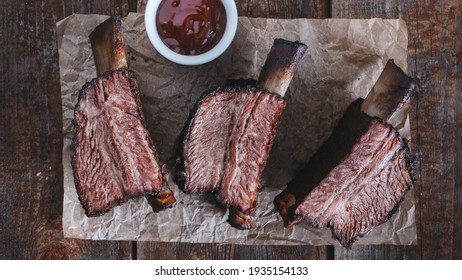 Smoked beef ribs bbq on a wooden table