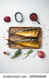 Smoked fish mackerel, on white background, top view flat lay