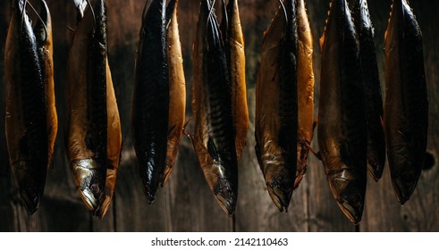 Smoked Fish Mackerel Or Scomber In Smokehouse. Smoking Process Fish. Banner, Menu, Recipe Place For Text.