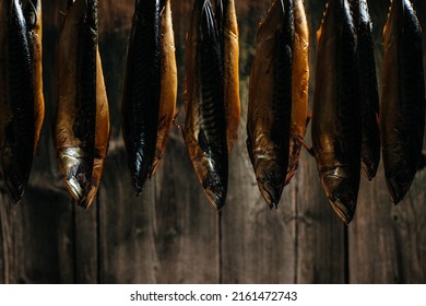 Smoked Fish Mackerel Or Scomber In Smokehouse. Smoking Process Fish. Banner, Menu, Recipe Place For Text.