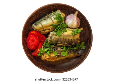 Smoked Fish Mackerel With Vegetables And Garlic On A Clay Plate