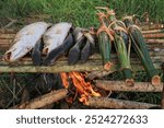 Smoked fish as a method of preserving fish for consumption.