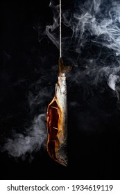 smoked fish on a dark background