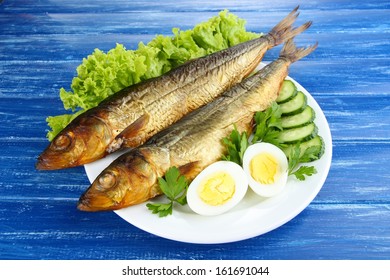 Smoked Fish On Plate On Wooden Table