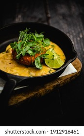 Smoked Haddock And Chive Fishcakes Served With Mixed Baby Leaf Salad And Creamed Cheesy Leek Sauce