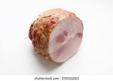 Smoked ham isolated on a white background. Homemade, smoked cold cuts, in netting, cut, with visible cross section. Traditional meat product, a packshot photo for package design, template.