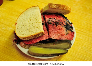 Smoked And Hand Carved Hot Pastrami Sandwich, Served With Pickled Cucumber