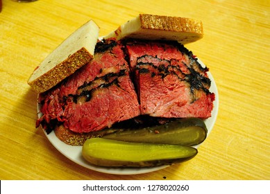 Smoked And Hand Carved Hot Pastrami Sandwich, Served With Pickled Cucumber