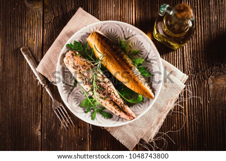 Smoked mackerel on wooden background