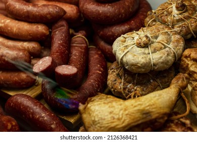 Smoked meat and a variety of sausages on the counter in the store. Close-up.