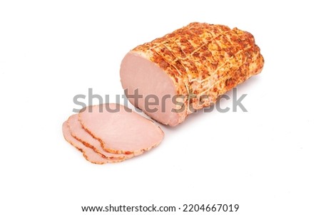 Smoked pork loin - in one piece and sliced, isolated on a white background. Homemade, Polish cold cuts, in netting. Traditional meat product, a packshot photo.