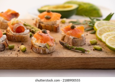 Smoked Salmon And Cream Cheese Canapés With Herbs And Avocado