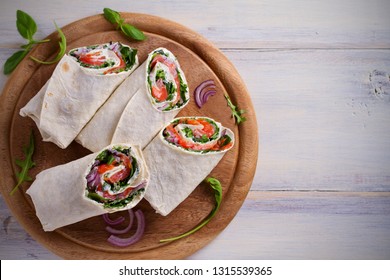 Smoked Salmon, Cream Cheese, Spinach And Arugula Wraps. Fish Burritos. Overhead, Horizontal