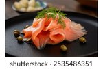 Smoked Salmon: Silky smoked salmon, thinly sliced and served with capers and dill,