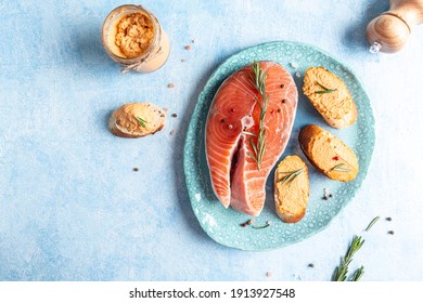 Smoked Salmon And Soft Cheese Spread Pate With Brown Bread. Mousse With Rosemary On A Ceramic Plate, Blue Background. Place For Text Top View.