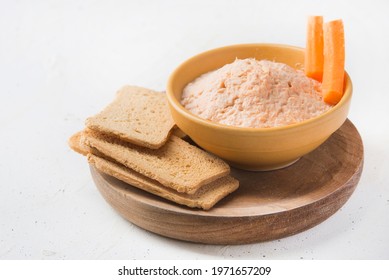 Smoked Salmon And Soft Cheese Spread Pate With Brown Bread And Carrot On White Background.