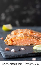 Smoked Salmon Or Trout Red Fish Fillet On Black Slate Board. Vertical Orientation, Copy Space