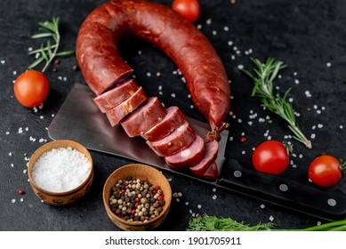 smoked sausage on a stone background