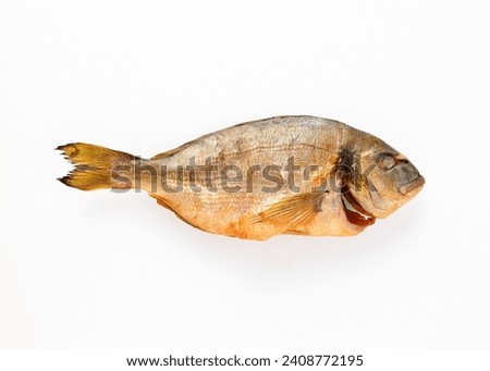 Smoked sea breath dorado fish on isolated white background close up top view. Salty snacks. Omega3. Mediterranean seafood concept. Healthy food concept. Top view, copy space