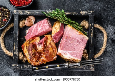 Smoked Sliced Pork Slab Bacon Meat In A Wooden Tray. Black Background. Top View.